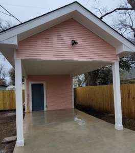 Free standing carport exterior construction service shown with a covered driveway in West Austin, TX