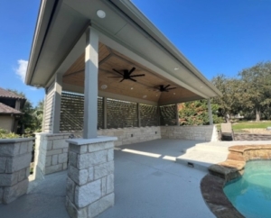 Poolside cabana with ceiling fans outside a home in Austin, TX
