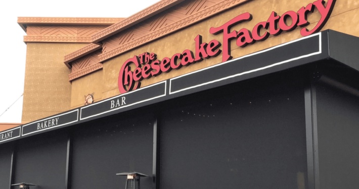 Cheesecake Factory restaurant exterior covered with commercial Magna track screen in Austin, TX